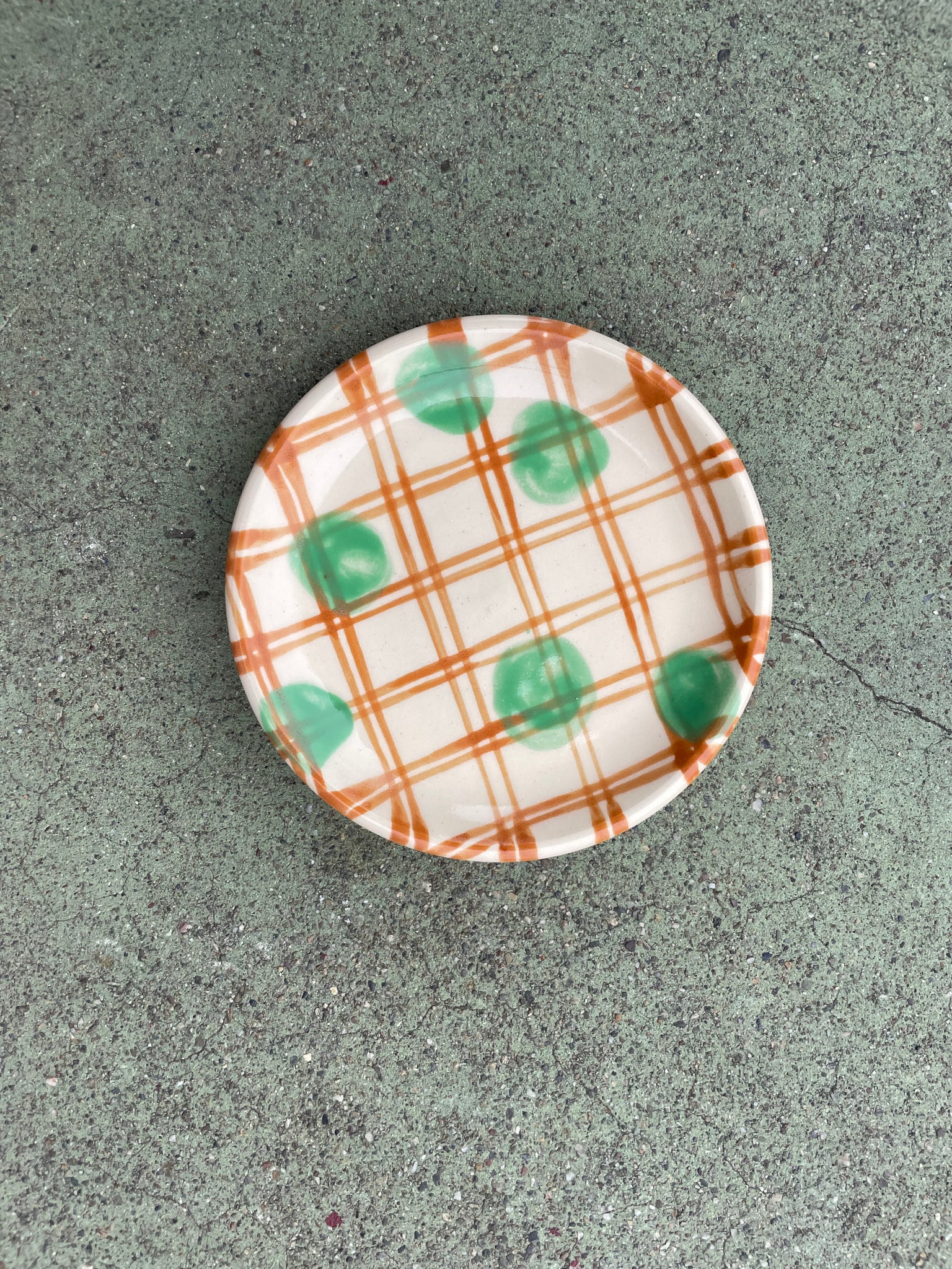 small plate brown plaid + green polka dots