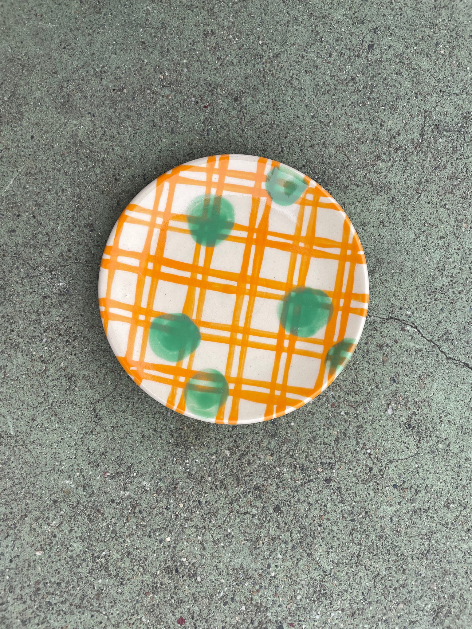 small plate orange plaid + green polka dots